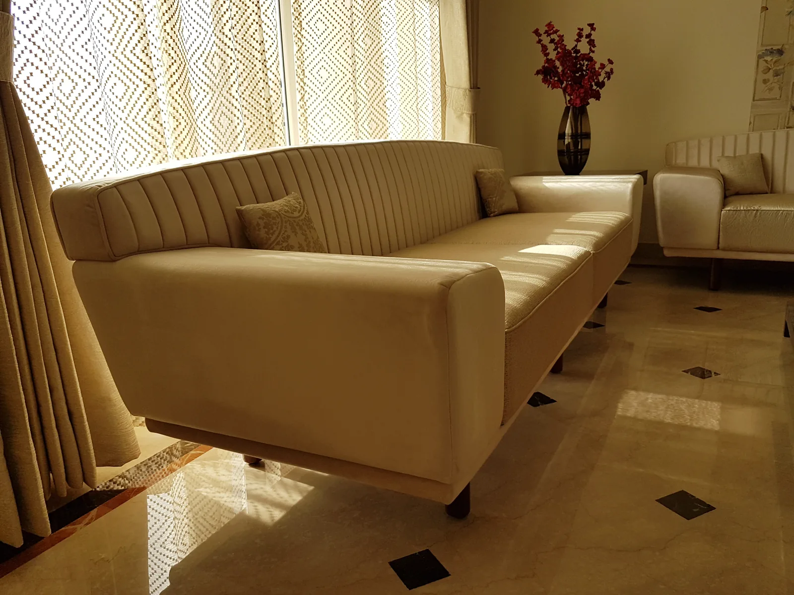 Finished custom beige fabric sofa installed in the living room.