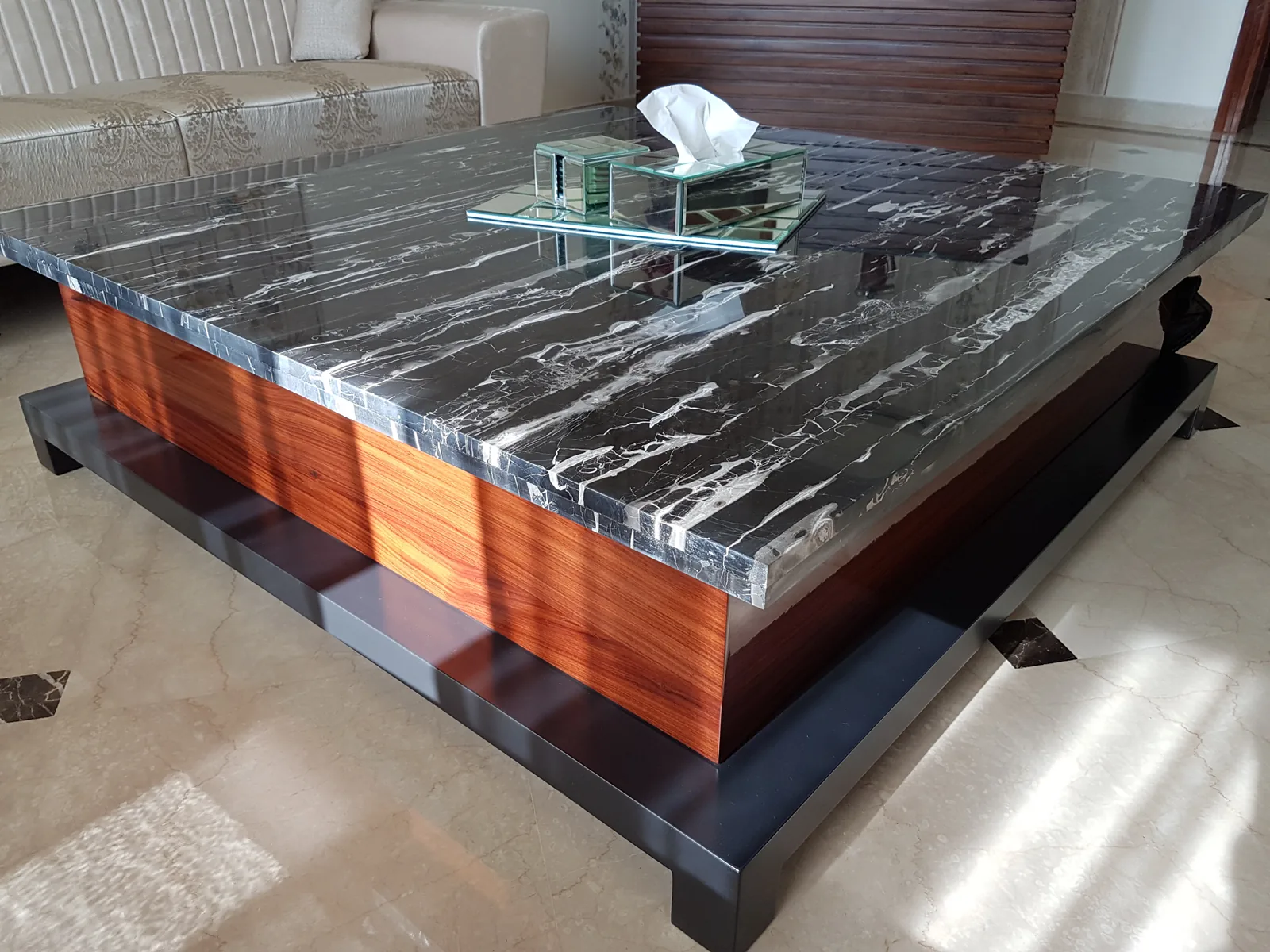 Custom black Italian marble coffee table on a walnut base.