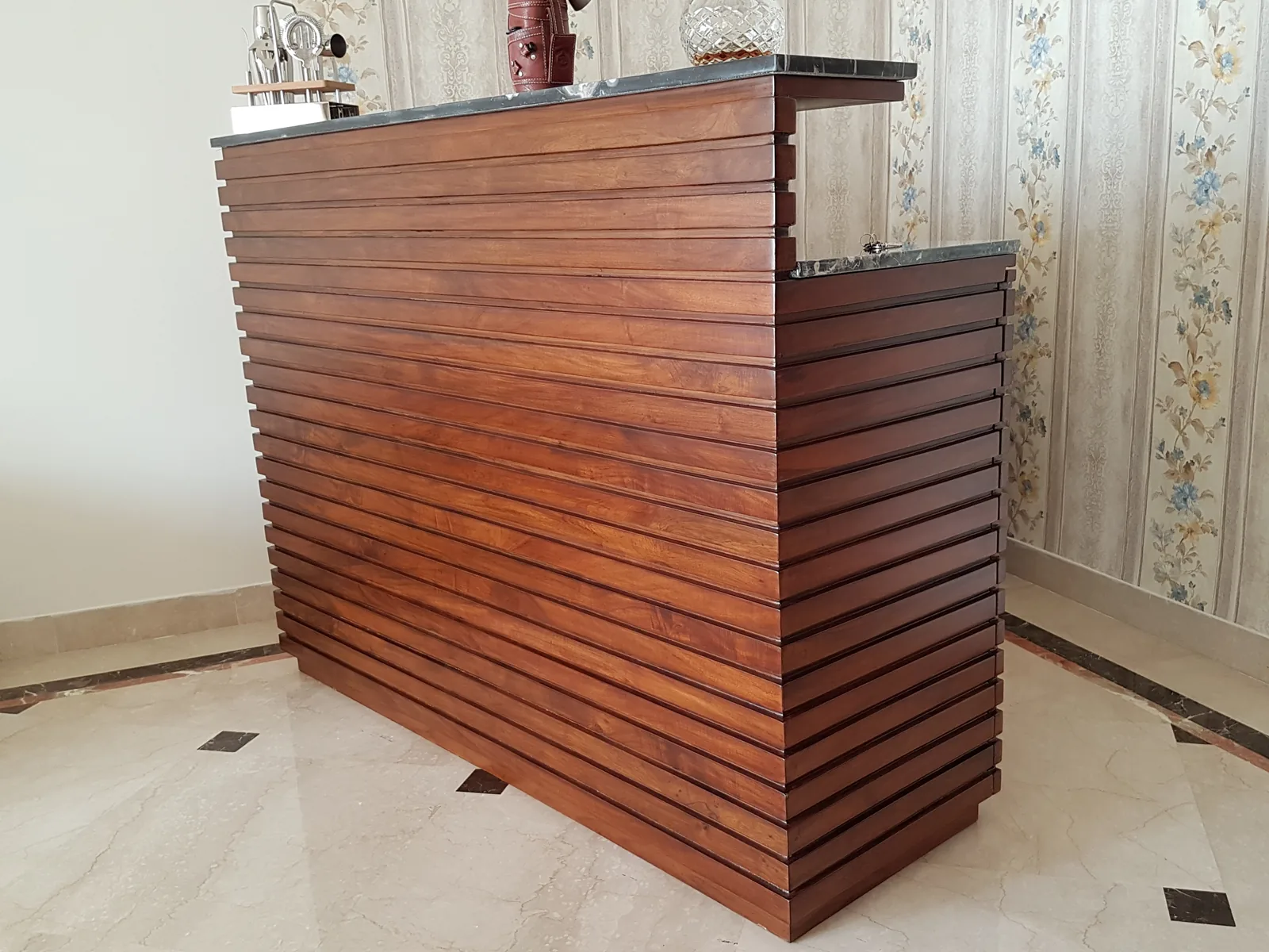 Custom slatted wood bar counter design.