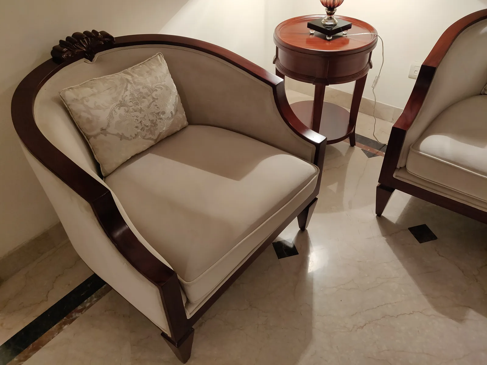 Curved accent chairs at Central Park 1, Golf Course Road, Gurgaon by SpaceTalk Designs