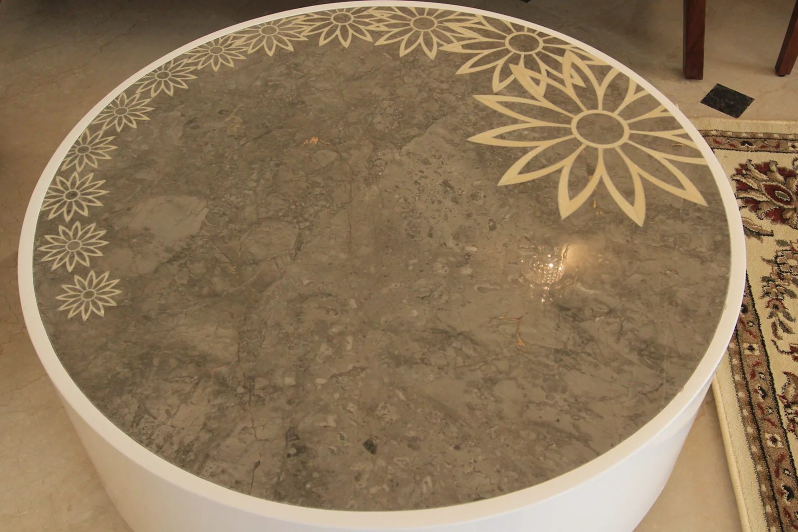 Red stone inlay on dining table at Central Park 1, Golf Course Road, Gurgaon by SpaceTalk Designs