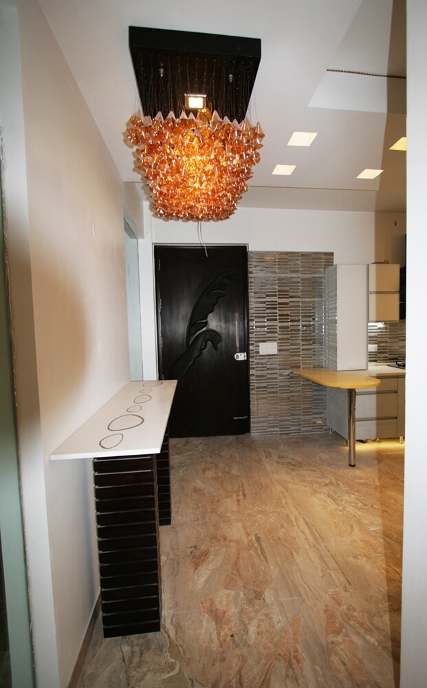 Custom amber teardrop chandelier in foyer