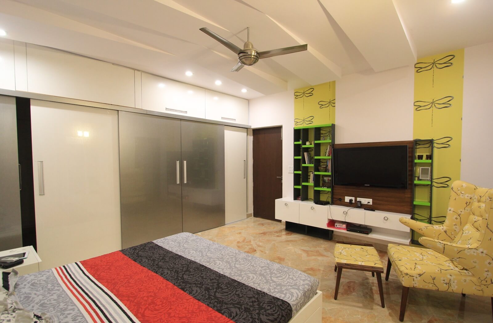 Master bedroom with high-gloss lime green and grey cabinetry
