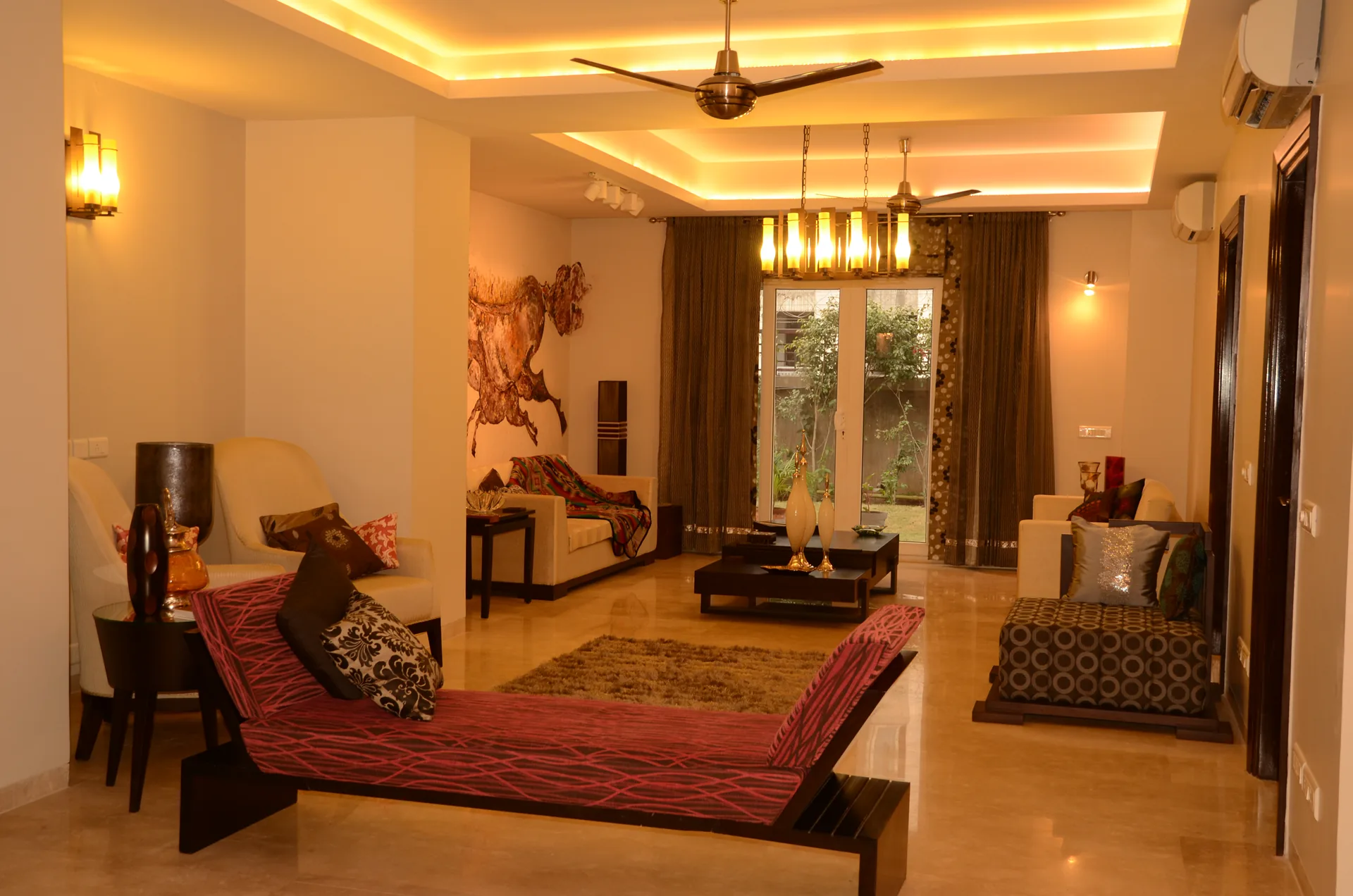 Double-height living room with custom furniture at Palm Springs Villa, Golf Course Road, Gurgaon by SpaceTalk Designs