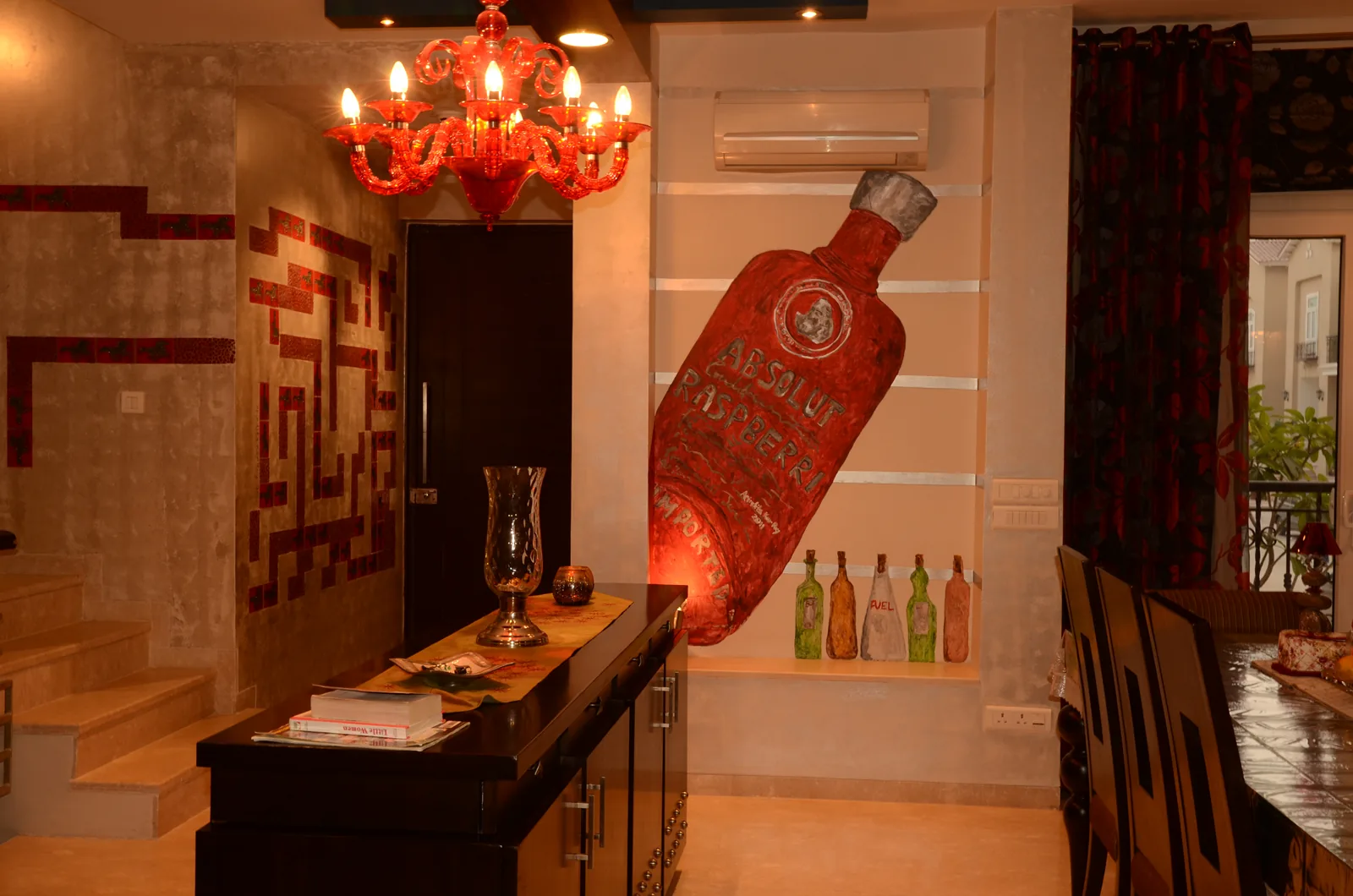 Entrance foyer with Absolut mural and custom mosaic tiles at Palm Springs Villa, Gurgaon by SpaceTalk Designs