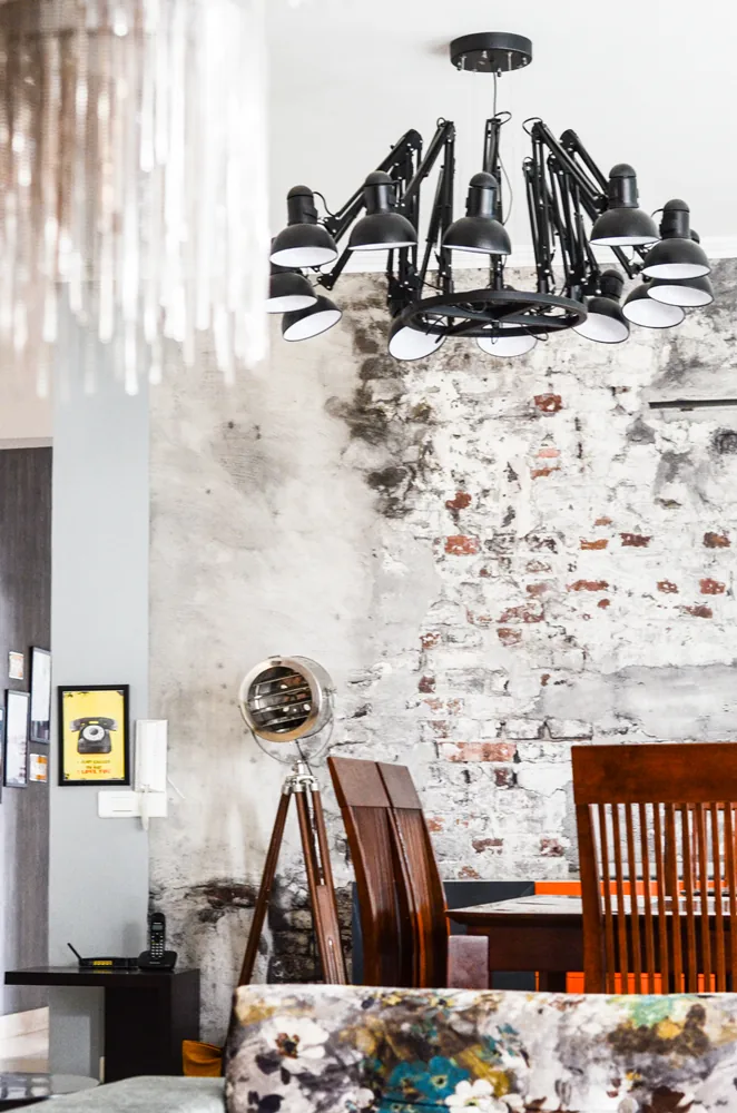 Grunge ceiling with crystal chandelier on Golf Course Extension Road, Gurgaon by SpaceTalk Designs