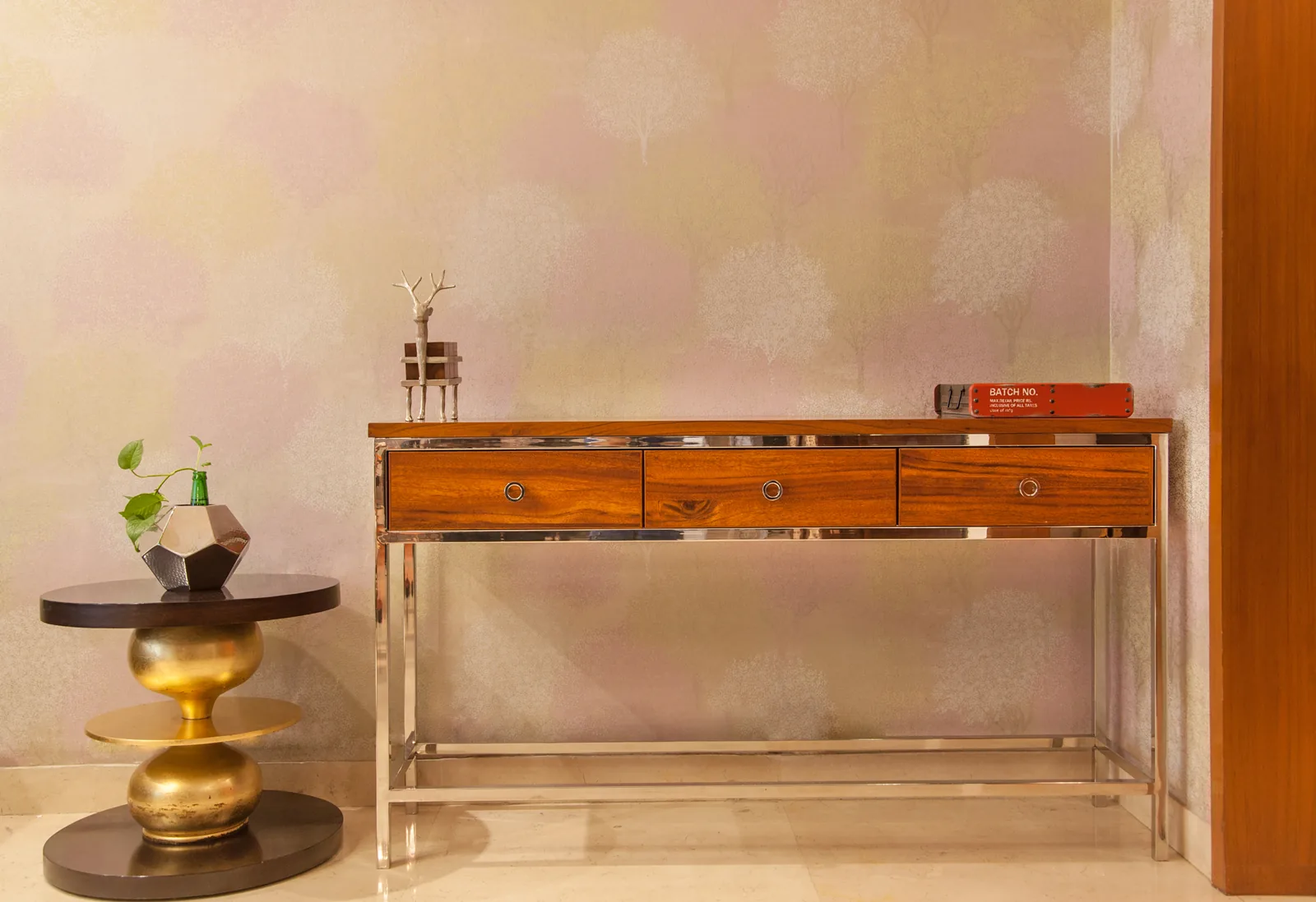 Custom wood console with steel legs on Golf Course Extension Road, Gurgaon by SpaceTalk Designs